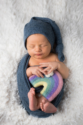 Rainbow Baby holding Rainbow