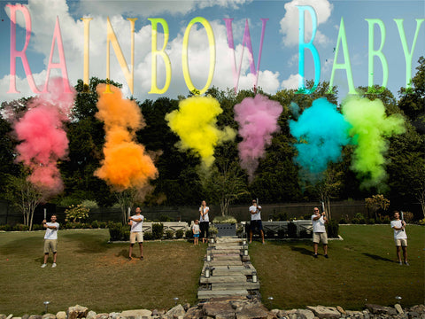 Rainbow baby gender reveal powder cannons Poof there it is Tori and Jon