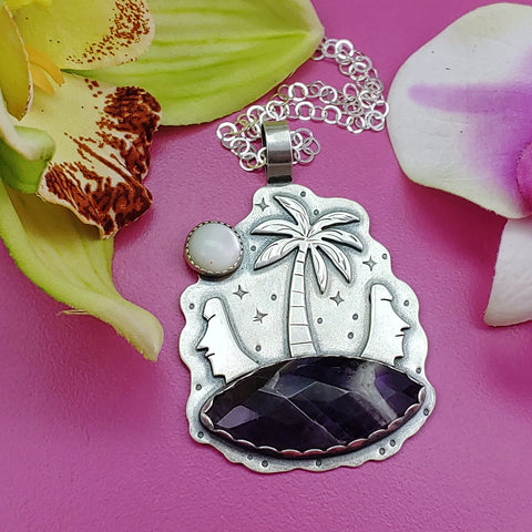 Sterling silver tiki necklace featuring moai heads, palm trees and chevron amethyst