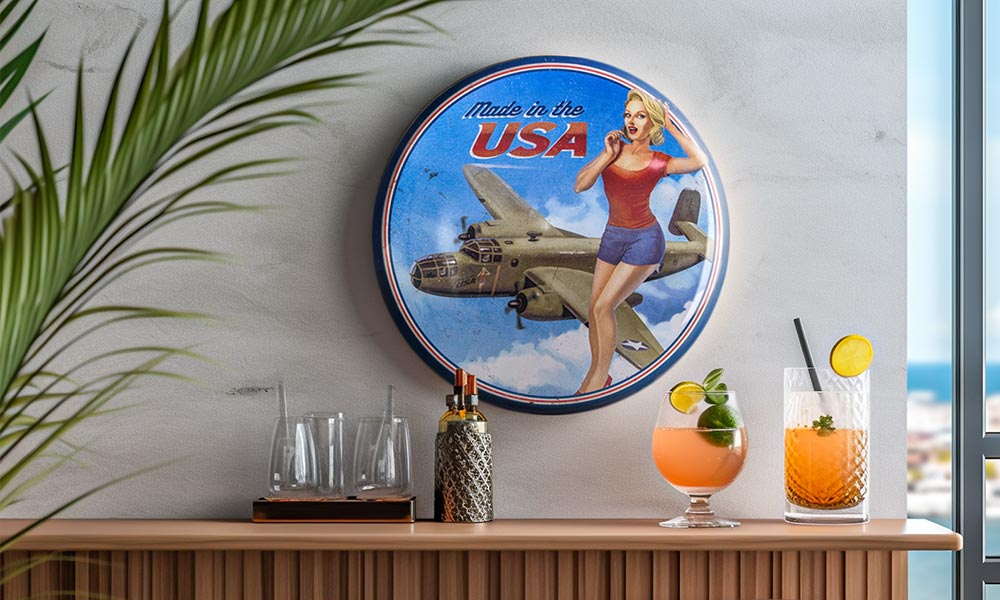 An American Art Decor Made in the USA dome metal sign hanging on a home bar wall overlooking a beach.