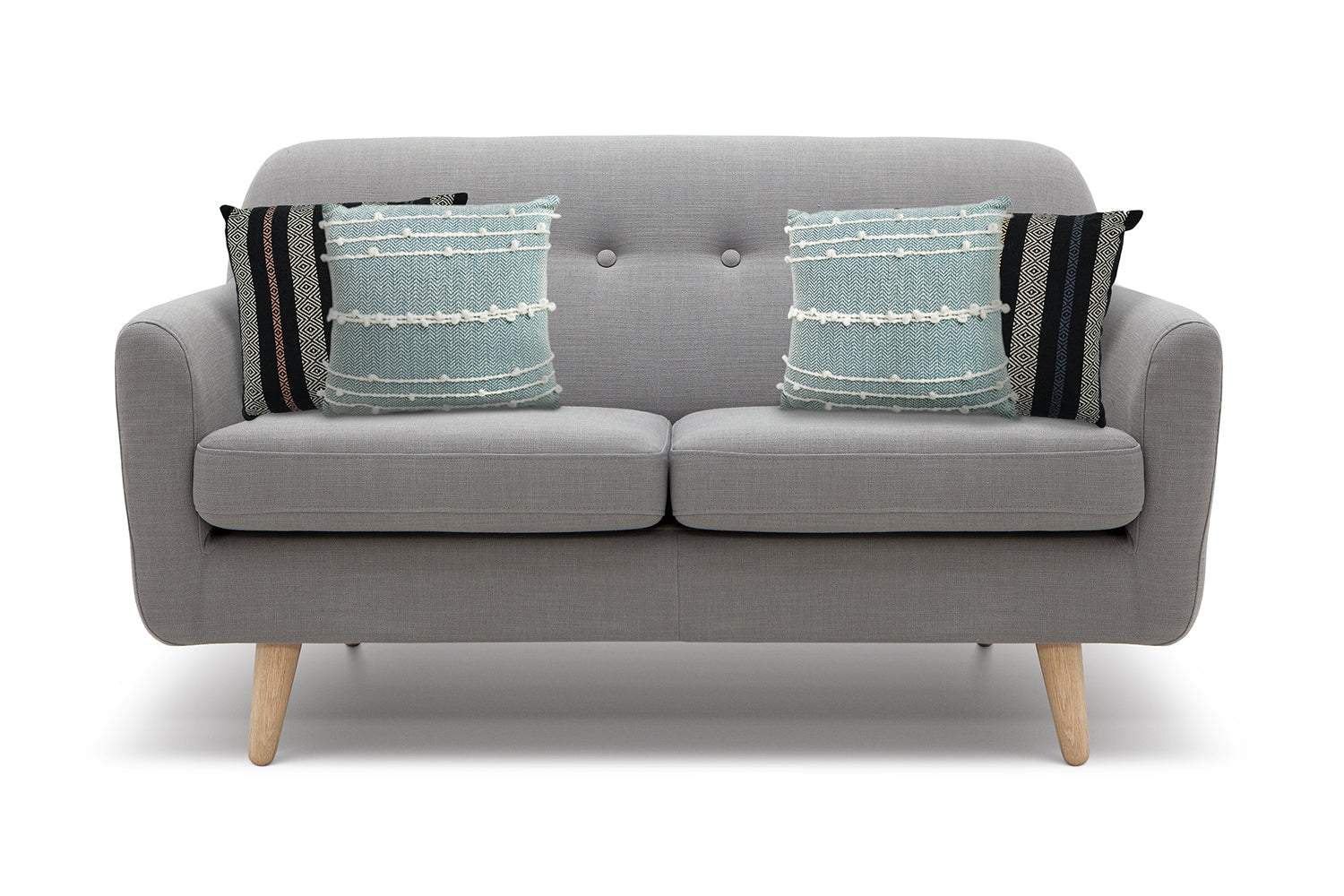 Grey loveseat with four pillows two in either corner