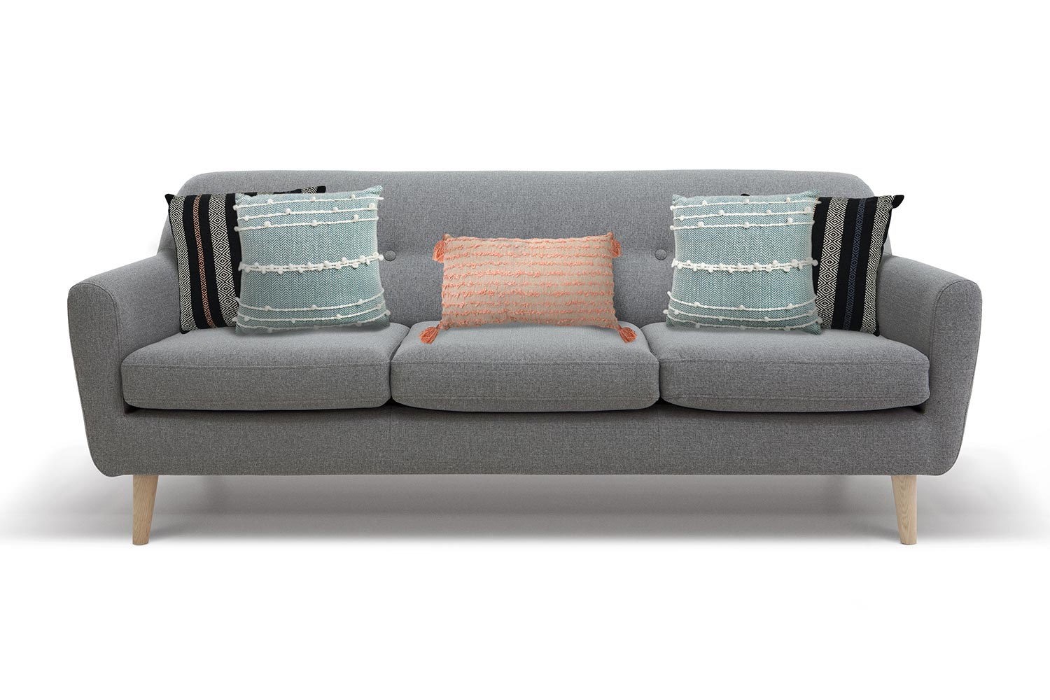 Grey couch with five pillows, two in either corner and one lumbar pillow in the middle