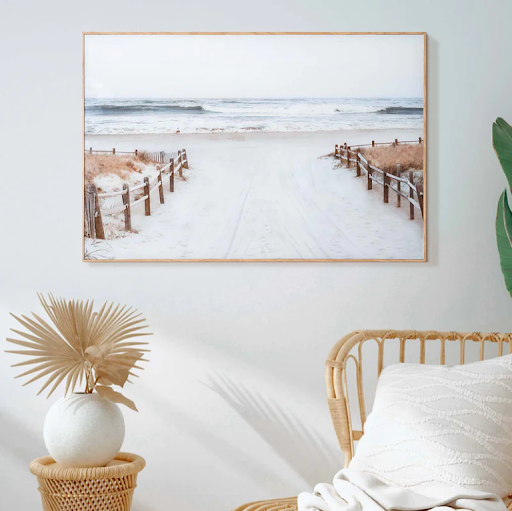 American Art Decor's Path to Paradise Printed Glass wall art hanging in a living room.