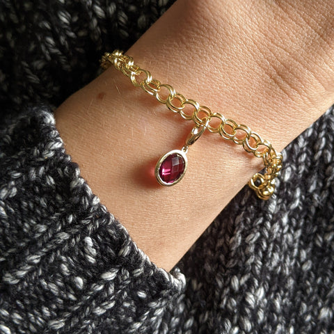 Christine Alaniz Designs gold and garnet charm bracelet