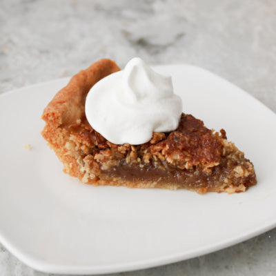 Slice of Homemade Oatmeal Pie with Whipped Topping