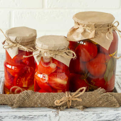 glass jars of bottled tomatoes