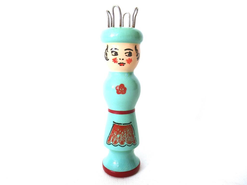 wooden knitting doll