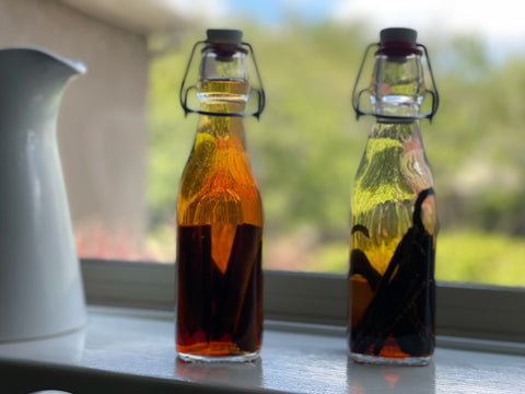 Two vanilla extract jars