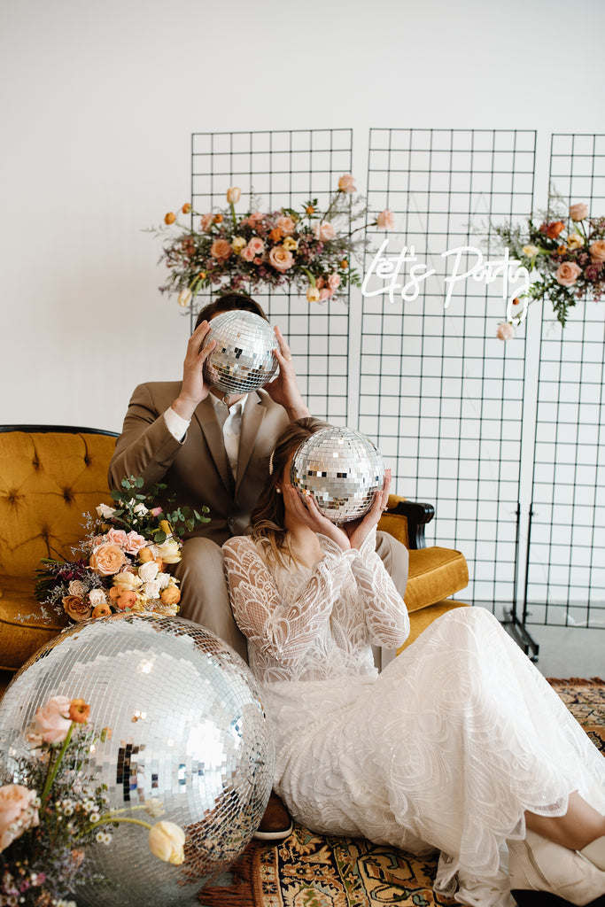 Bride and groom with disco balls