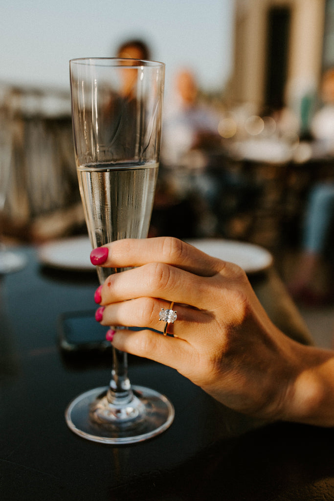 Champagne with oval engagement ring
