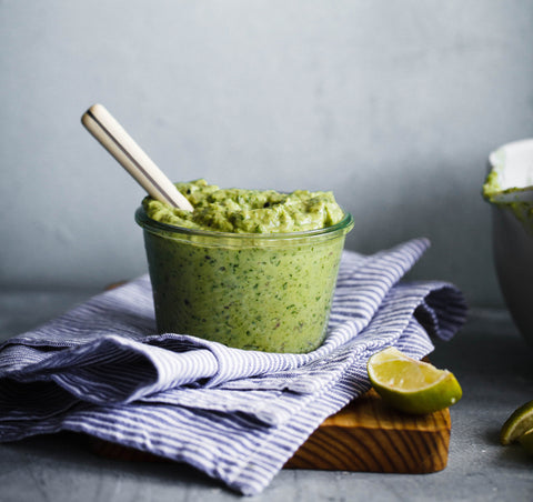 7 superfoods for glowing skin and healthy hair. Image of an avocado in guacamole