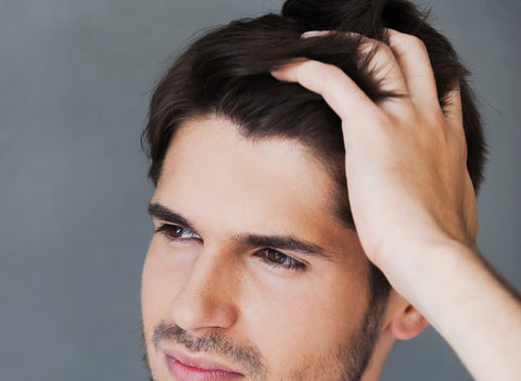 Handsome young man with healthy hair growth