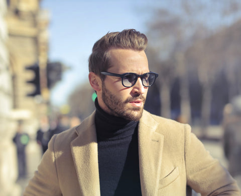 Handsome young man posing for photos in Paris