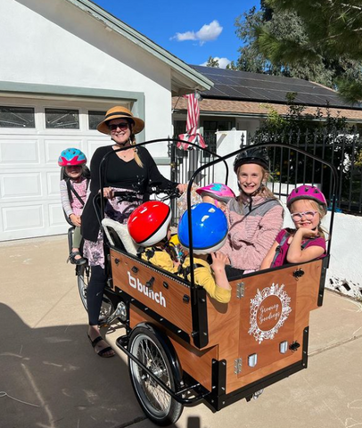 7 kids in preschool bunch bike including one on the rear rack