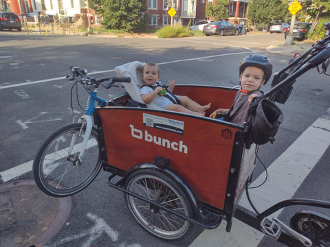 Bunch bike carrying baby and toddler with older kid's bike