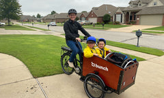 Two children and a wheelchair in a Bunch Bike with seatbelts