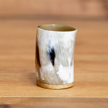 https://cdn.shopify.com/s/files/1/2022/8291/files/skullvikings_viking_norse_larp_polished_small_horn_cup_wooden_bottom_uk-2.jpg?v=1702925774&width=380