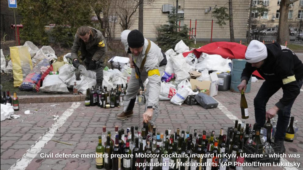 Ukrainians prepare Molotov cocktails in Kyiv