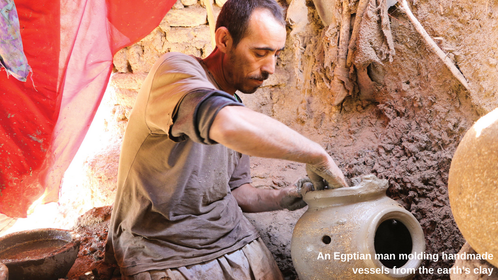 Egptian man molding a handmade vessel from clay - Egypt artisanal ceramics