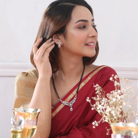 An image of a woman wearing a black beads mangalsutra