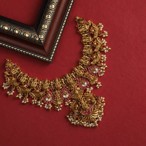 An image of a wedding necklace on a red background