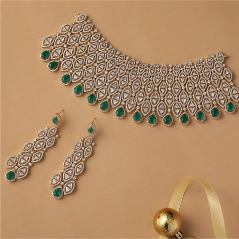 An image of an Indian choker with Cubic Zirconia and green gemstones
