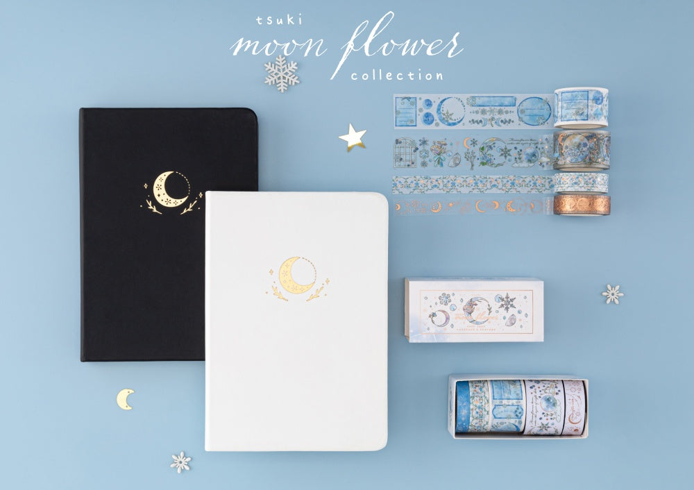 Flatlay of Tsuki Moonflower notebook in black and white and winter moonflower washi tape set with text Tsuki Moonflower collection
