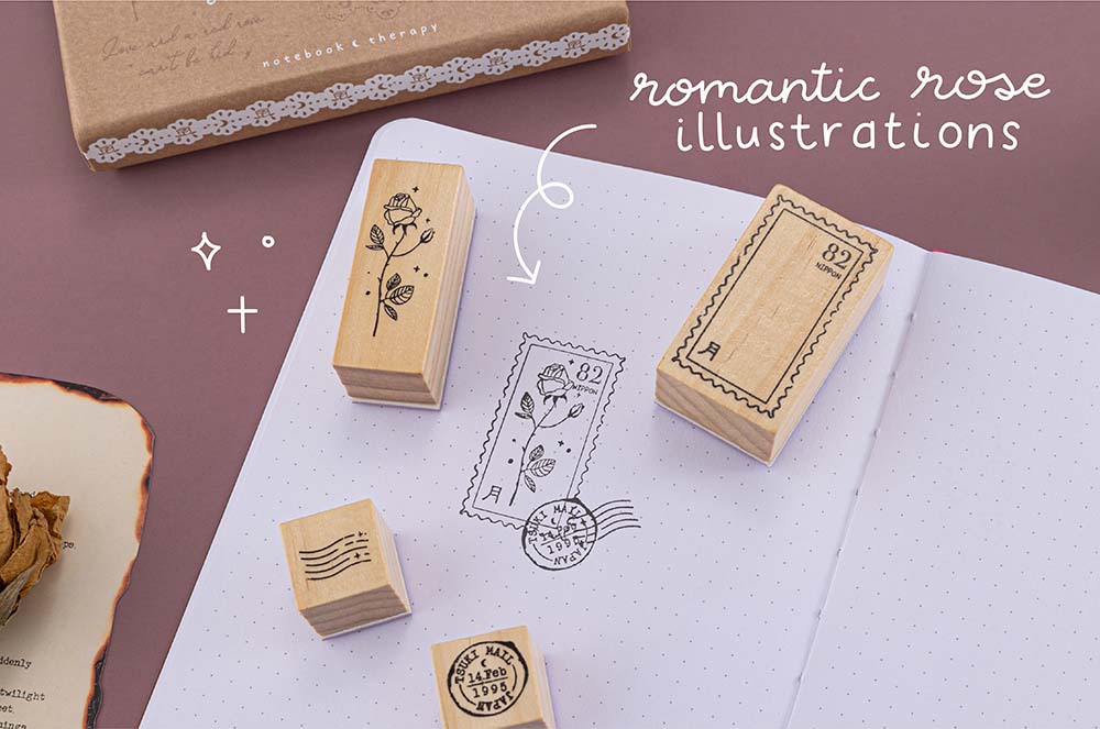 Tsuki ‘Vintage Rose’ Bullet Journal Stamp Set with Tsuki ‘Vintage Rose’ Limited Edition Bullet Journal with dried flowers and burnt paper on mauve background