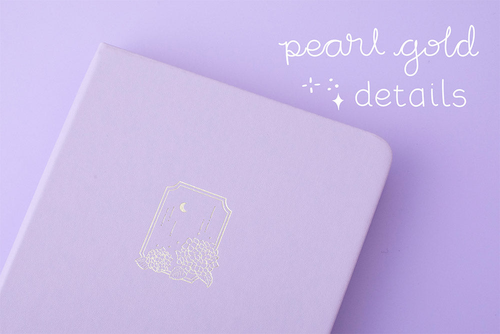 Close up of Tsuki Endless Summer Limited Edition Bullet Journal in Lilac Bloom with pearl gold details on lilac background