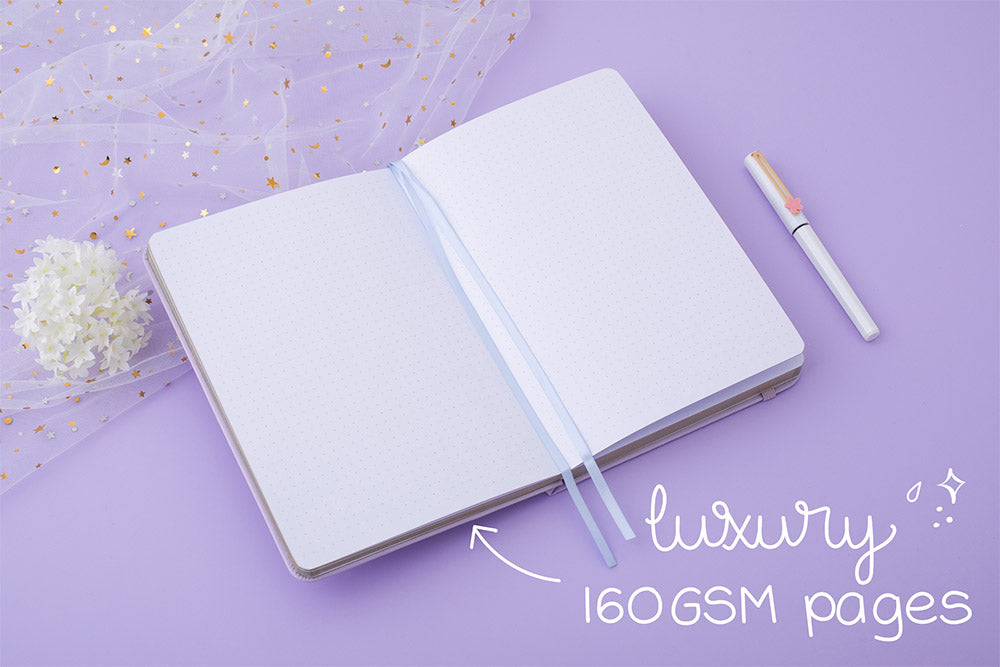 Tsuki Endless Summer Limited Edition Bullet Journal in Lilac Bloom with luxury 160GSM pages with sparkly netting and white hydrangea flowers and pen on lilac background