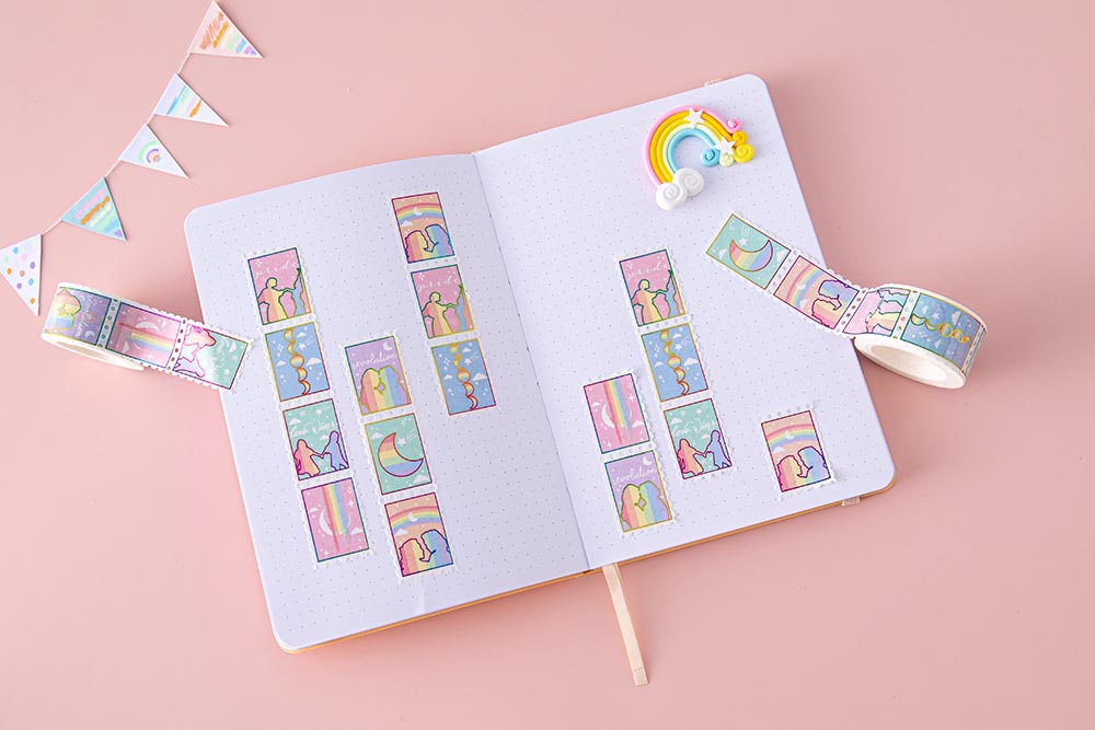 Tsuki Rainbow Pride Washi Tape on open Tsuki Pastel Edition Bullet Journal page with rainbow and bunting on light pink background