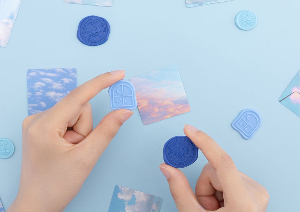 Wax seal stickers and writing stickers on blue background