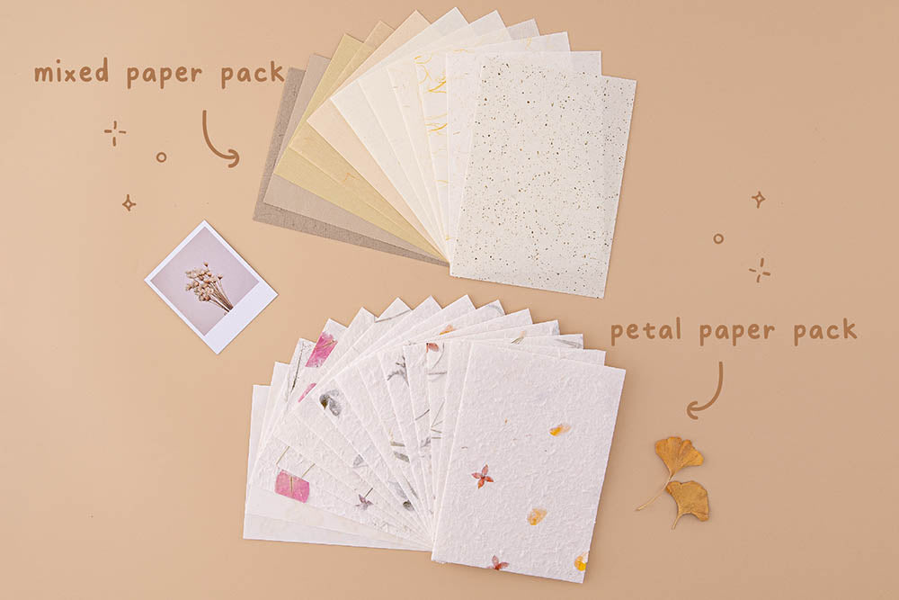 Tsuki Handmade Petal Papers with Tsuki Mixed Scrapbook Paper Pack with polaroid picture and autumn leaves on beige background