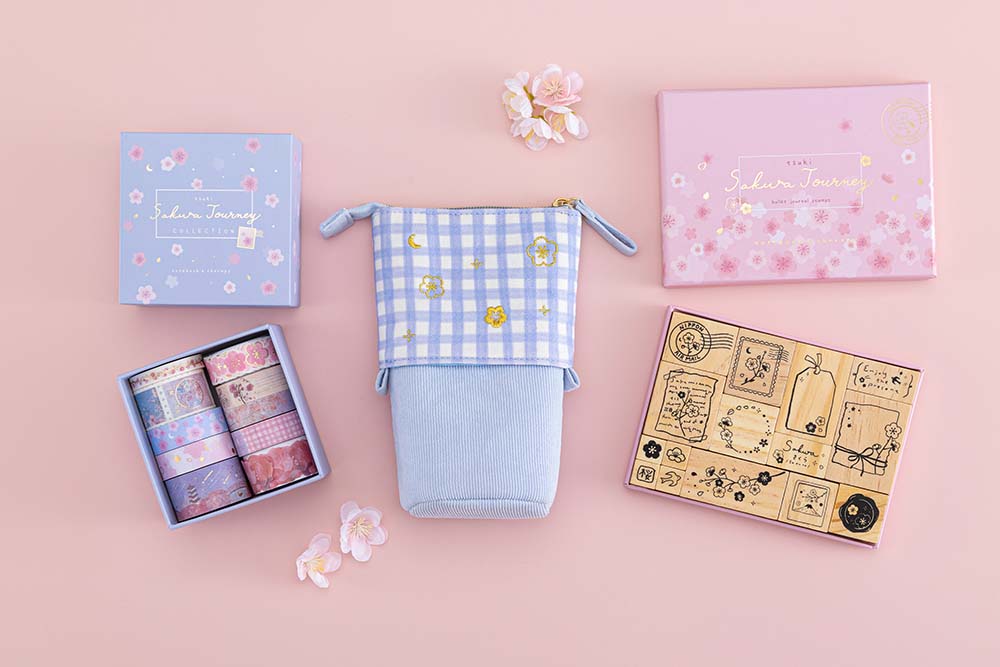 Tsuki ‘Sakura Journey’ Pop-Up Pencil Case with Tsuki ‘Sakura Journey’ Bullet Journal Stamp Set and Tsuki ‘Sakura Journey’ Washi Tape Set with cherry blossoms on light pink background