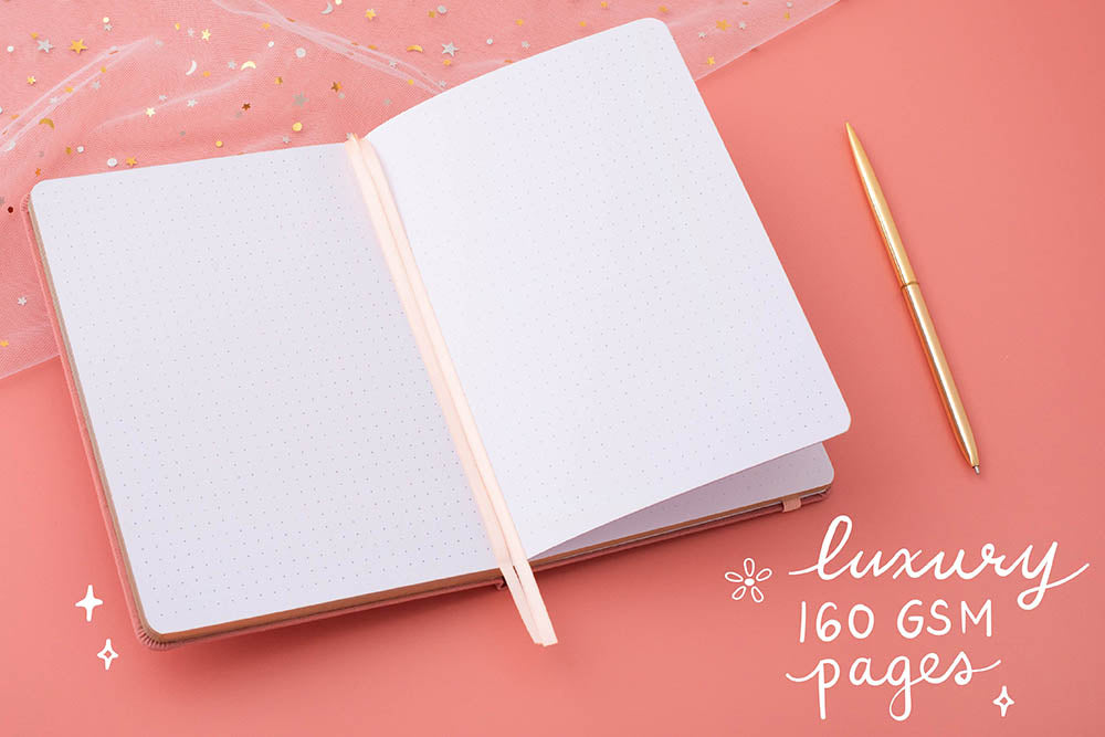 Tsuki ‘Suzume’ Limited Edition Bullet Journal with luxury 160GSM pages with pen and netting on coral pink background