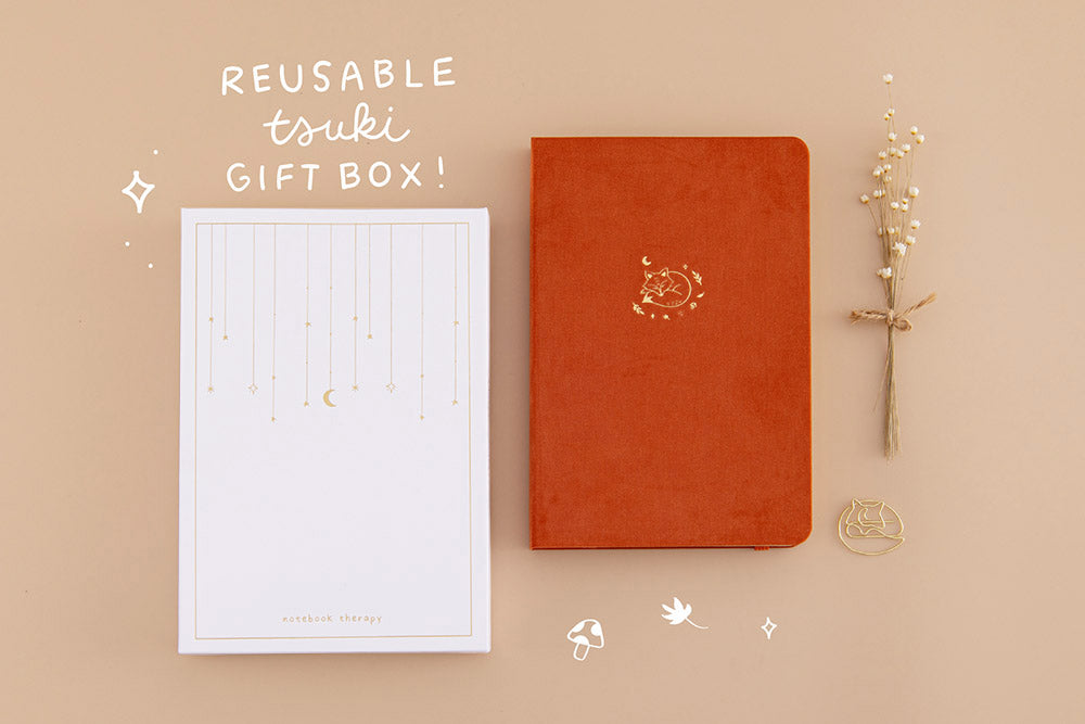 Tsuki ‘Kitsune’ Limited Edition Fox Bullet Journal with reusable tsuki gift box and free paperclip gift with dried flowers on beige background