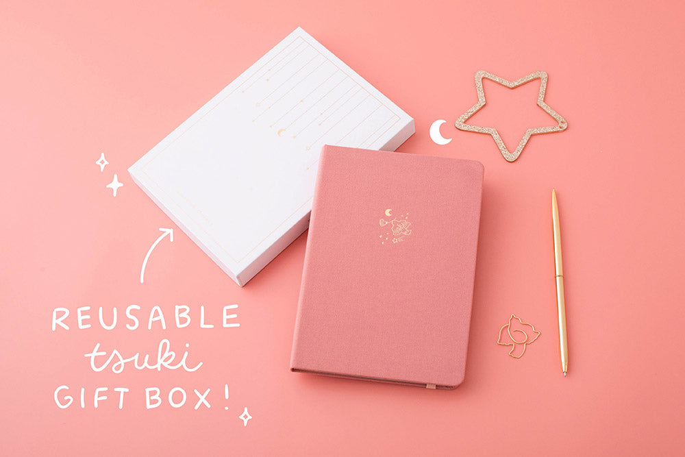 Tsuki ‘Suzume’ Limited Edition Bullet Journal with reusable Tsuki gift box with pen and star on coral pink background