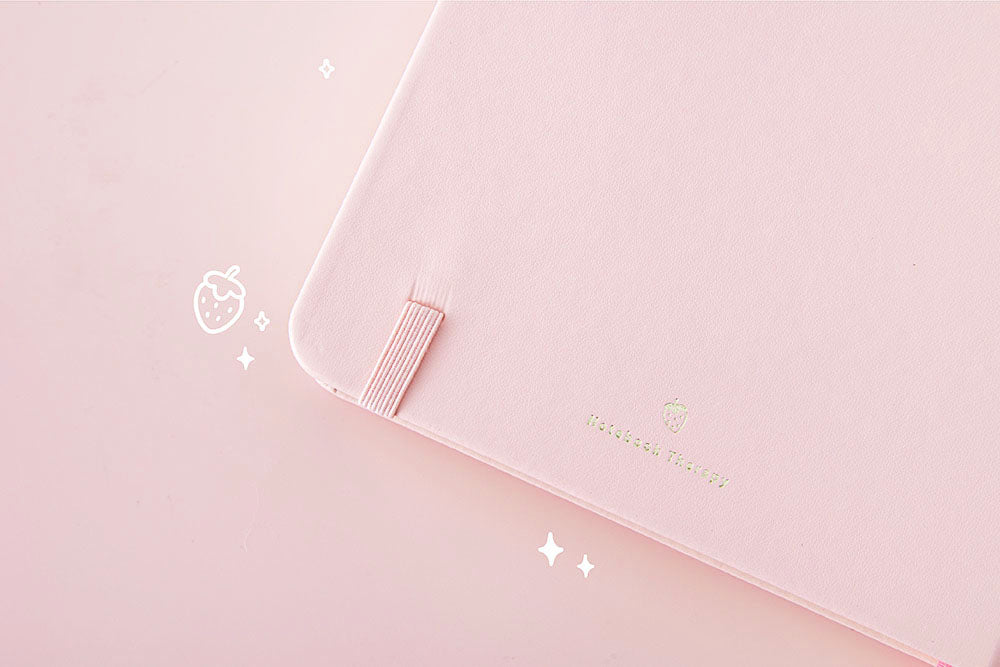Close up of back page cover of Tsuki ‘Ichigo’ Limited Edition Boba Bullet Journal on light pink background