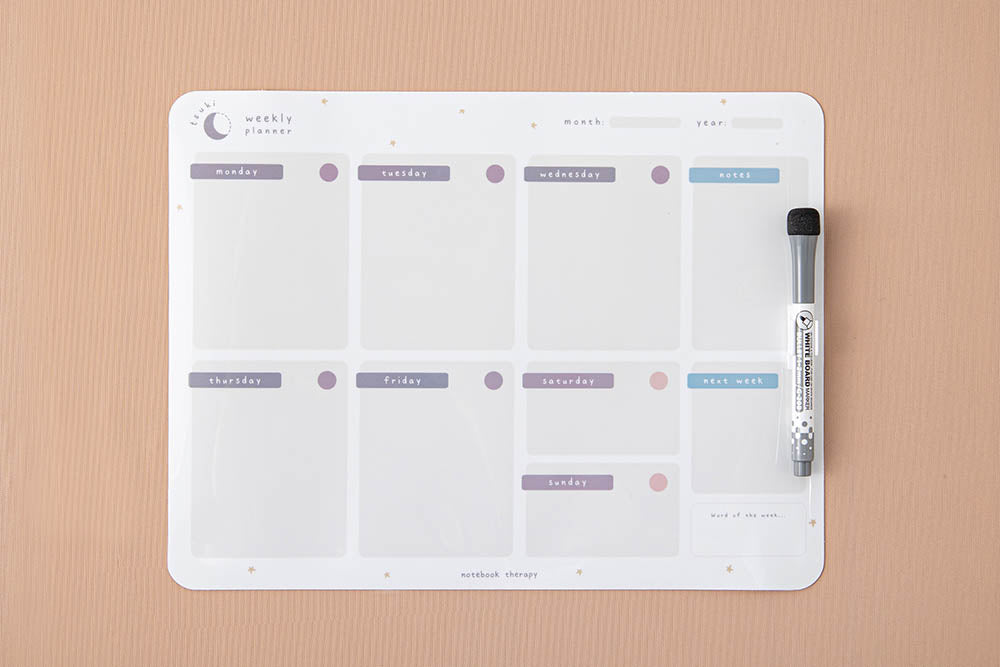 Tsuki Reusable Wall Planner with dry erase marker on smooth wallpaper surface