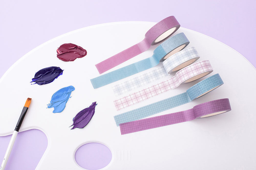 Tsuki Core Washi Tape Set in Cool Neutral with paint and paintbrush on artist’s paint palette on lilac background
