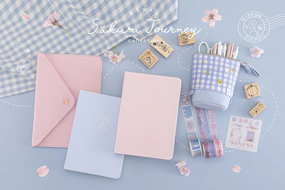 Tsuki Sakura Journey Collection with cherry blossom petals and light blue gingham cloth on light blue background