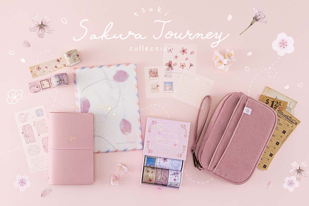 Tsuki ‘Sakura Journey’ Vintage Journal Washi Tape Set with Tsuki ‘Sakura Journey’ Limited Edition Travel Notebook and Tsuki ‘Sakura Journey’ Scrapbooking Set’ and Tsuki ‘Sakura Journey’ Travel Pouch with cherry blossoms on pink background