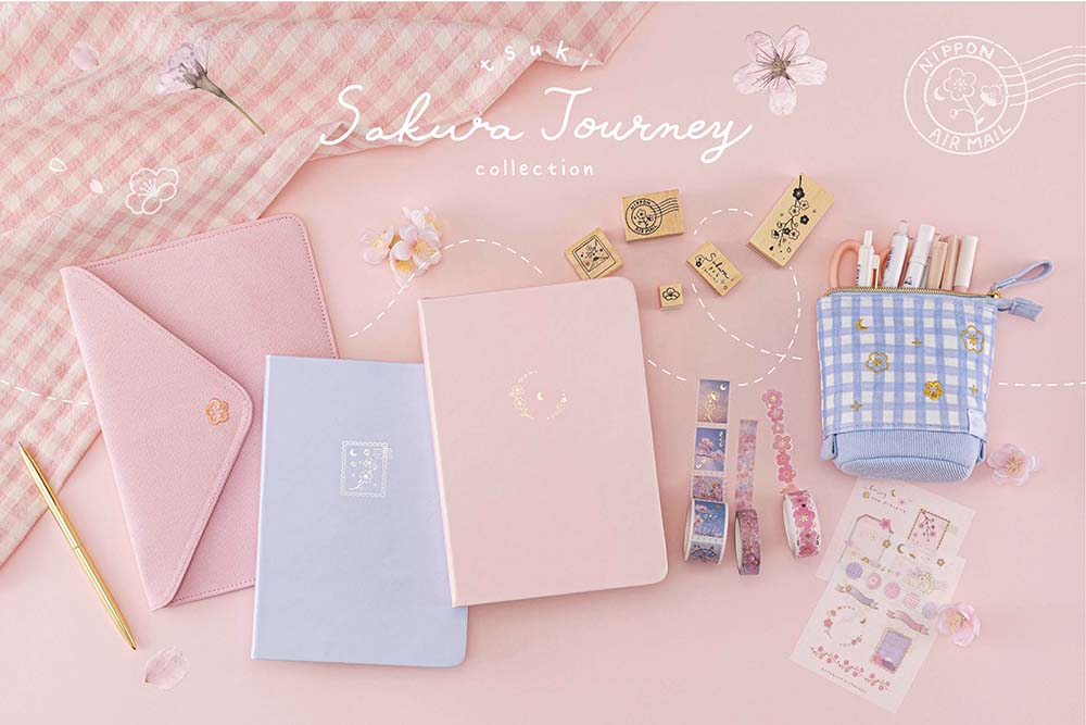 Tsuki Sakura Journey Collection on light pink gingham with cherry blossoms and gold pen on light pink background