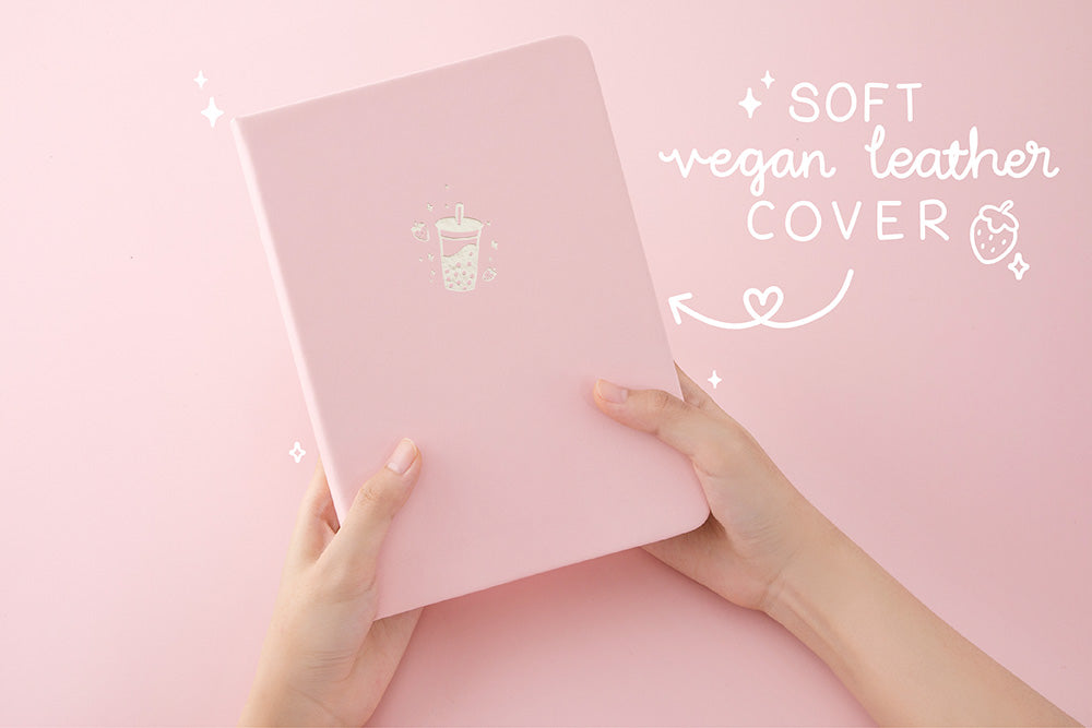 Tsuki ‘Ichigo’ Limited Edition Boba Bullet Journal with soft vegan leather cover held in hands in light pink background