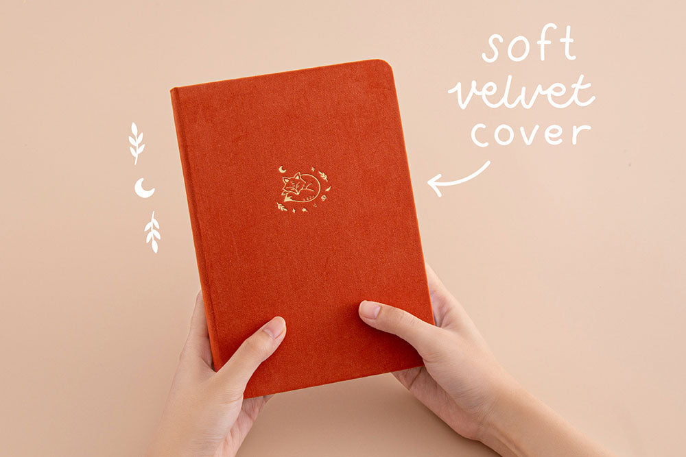 Tsuki ‘Kitsune’ Limited Edition Fox Bullet Journal with soft velvet cover held in hands in beige background
