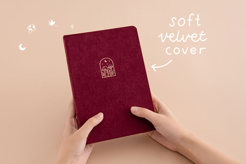 Tsuki ‘Kinoko’ Limited Edition Bullet Journal with soft velvet cover held in hands in beige background