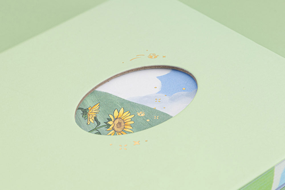 Tsuki Four Seasons Summer Collectors Edition 2022 sage bullet journal notebook close-up of the cutout window showing sunflower illustration