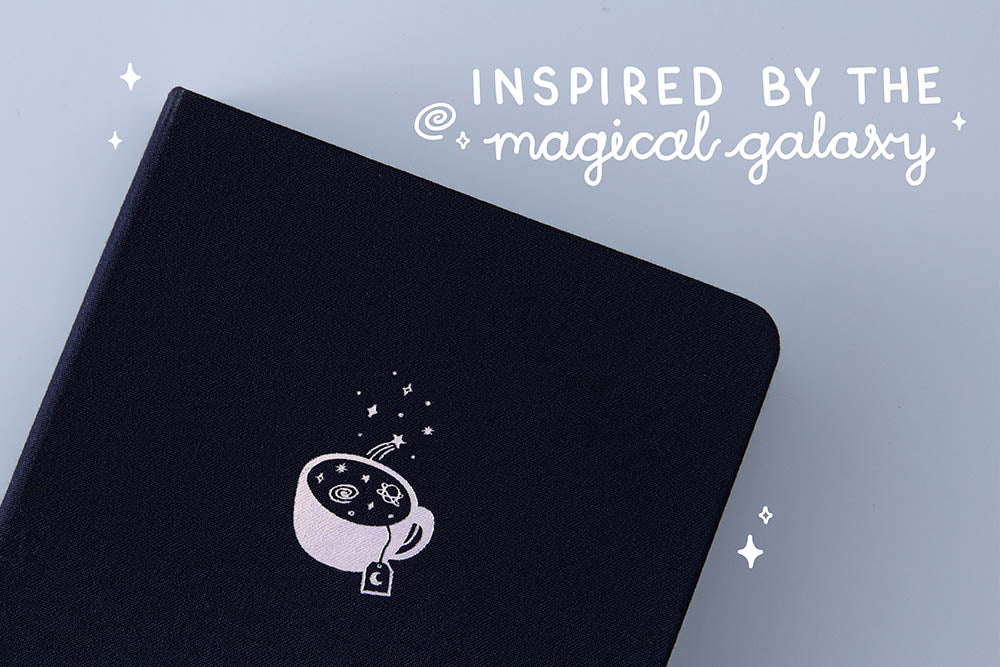 Close up of Tsuki ‘Cup of Galaxy’ Limited Edition Holographic Bullet Journal inspired by the magical galaxy on light blue background
