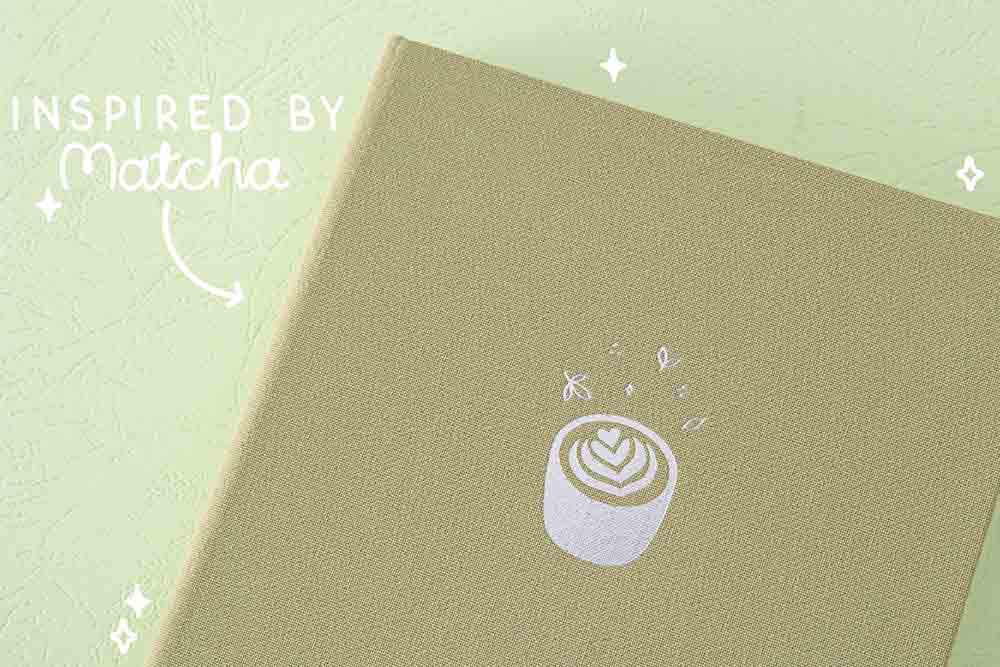 Close up of the front cover of Tsuki ‘Matcha Matcha’ Limited Edition Bullet Journal inspired by matcha on matcha green background