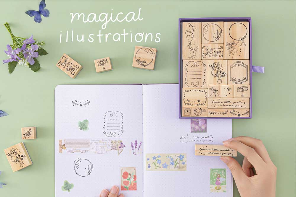 Tsuki ‘Enchanted Garden’ Stamp Set ‘magical illustrations’ on open flat dotted notebook